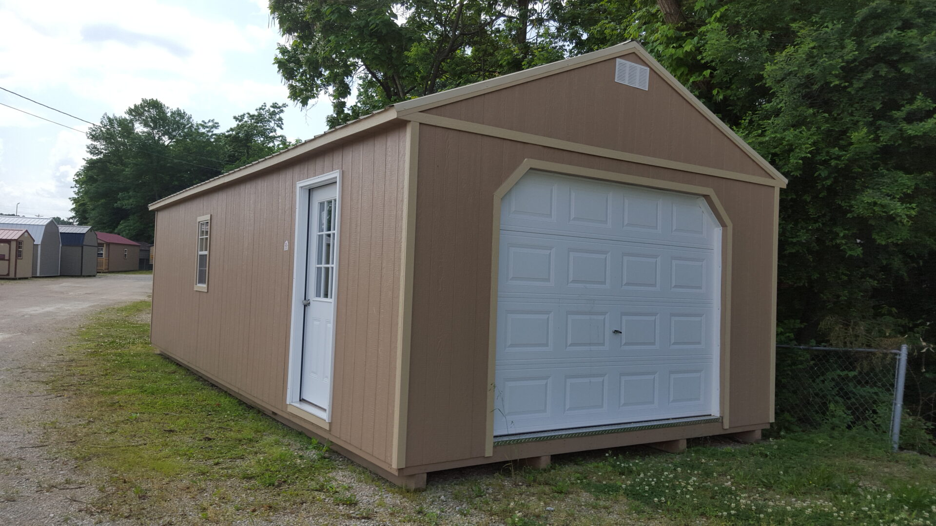 Portable garage outlet buildings